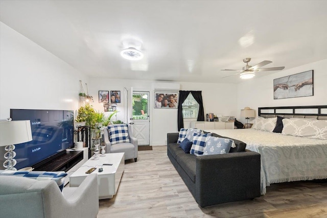 710 E 213th St, Bronx, NY 10467 - bedroom with light wood-style floors and a ceiling fan