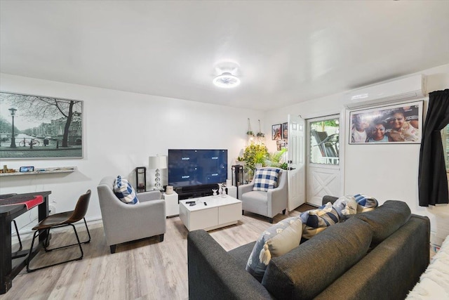 710 E 213th St, Bronx, NY 10467 - living area featuring a wall mounted air conditioner and light wood-style floors