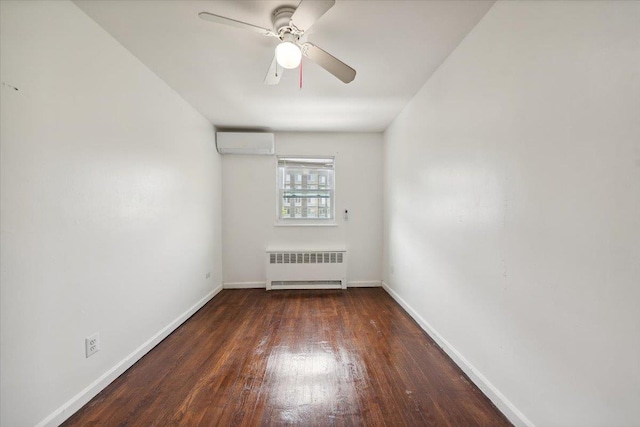 710 E 213th St, Bronx, NY 10467 - unfurnished room featuring radiator heating unit, a wall mounted AC, wood finished floors, and ceiling fan
