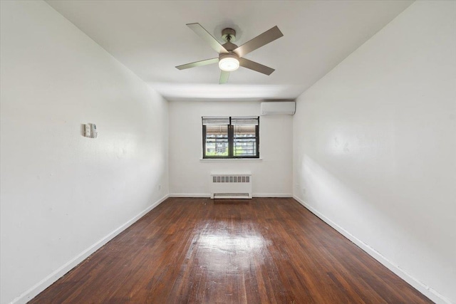 710 E 213th St, Bronx, NY 10467 - spare room with radiator heating unit, an AC wall unit, wood finished floors, and a ceiling fan