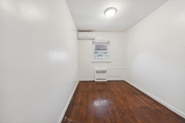 710 E 213th St, Bronx, NY 10467 - unfurnished room with radiator, wood finished floors, and an AC wall unit