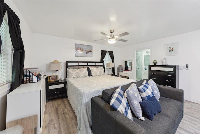 710 E 213th St, Bronx, NY 10467 - bedroom featuring light wood finished floors, ceiling fan, and ensuite bath
