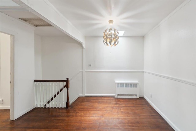 710 E 213th St, Bronx, NY 10467 - unfurnished room featuring radiator heating unit, a chandelier, and wood finished floors