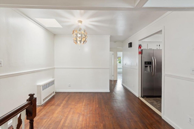710 E 213th St, Bronx, NY 10467 - unfurnished dining area with radiator, wood finished floors, a chandelier, and ornamental molding