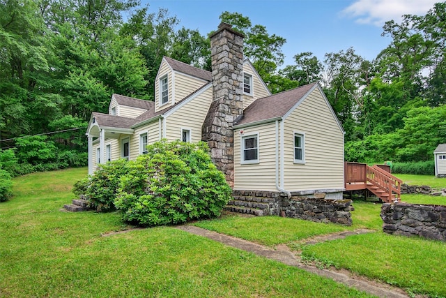 5776 Albany Post Rd, Cortlandt Manor, NY 10567 - view of property exterior with roof with shingles, a chimney, a lawn, and a deck