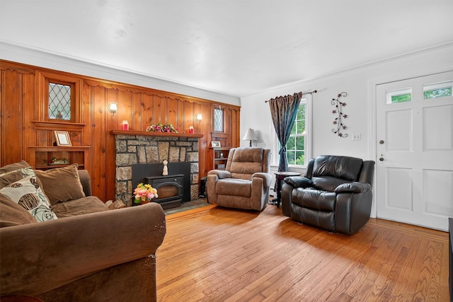 5776 Albany Post Rd, Cortlandt Manor, NY 10567 - living area featuring light wood-style flooring, wood walls, and a baseboard heating unit