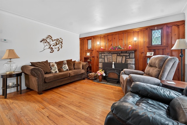 5776 Albany Post Rd, Cortlandt Manor, NY 10567 - living room featuring light wood finished floors, a wood stove, and crown molding