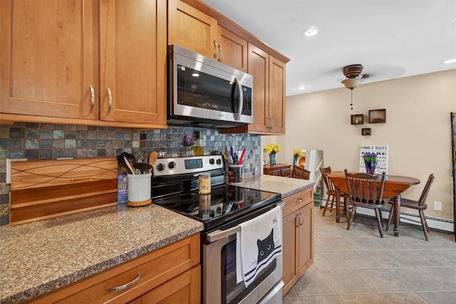 5776 Albany Post Rd, Cortlandt Manor, NY 10567 - kitchen with appliances with stainless steel finishes, backsplash, baseboard heating, light tile patterned flooring, and a ceiling fan