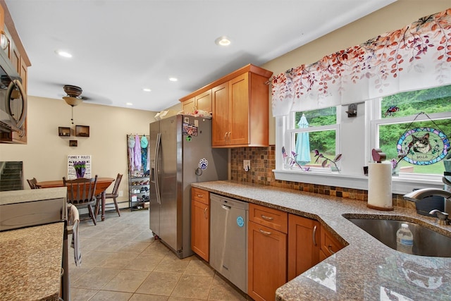 5776 Albany Post Rd, Cortlandt Manor, NY 10567 - kitchen with appliances with stainless steel finishes, light tile patterned floors, stone counters, recessed lighting, and tasteful backsplash