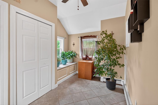 5776 Albany Post Rd, Cortlandt Manor, NY 10567 - entryway featuring ceiling fan, vaulted ceiling, a baseboard radiator, and light tile patterned flooring