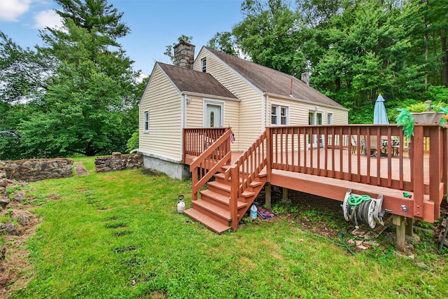 5776 Albany Post Rd, Cortlandt Manor, NY 10567 - back of house with a lawn, a chimney, a deck, and roof with shingles