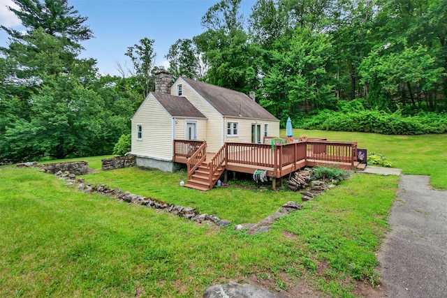 5776 Albany Post Rd, Cortlandt Manor, NY 10567 - rear view of property with a chimney, a wooden deck, and a yard