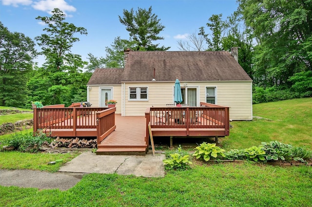 5776 Albany Post Rd, Cortlandt Manor, NY 10567 - back of house with a chimney, a yard, and a wooden deck