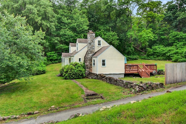 5776 Albany Post Rd, Cortlandt Manor, NY 10567 - view of side of property featuring a wooden deck, a lawn, a chimney, and a shingled roof