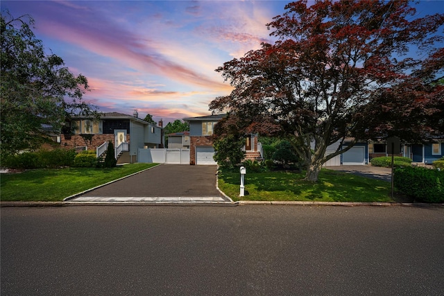 11 Trescott St, Dix Hills, NY 11746 - view of front of house featuring a garage and driveway