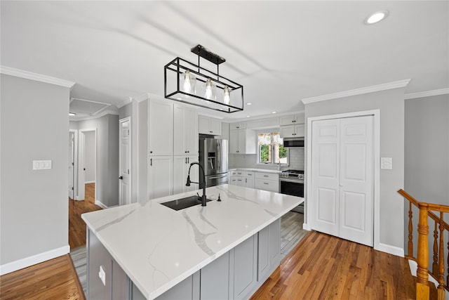 11 Trescott St, Dix Hills, NY 11746 - kitchen featuring stainless steel appliances, light wood-type flooring, white cabinetry, crown molding, and recessed lighting
