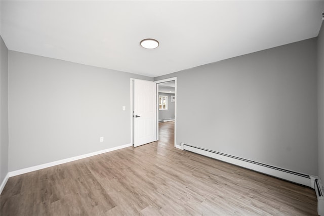 11 Trescott St, Dix Hills, NY 11746 - unfurnished room featuring a baseboard radiator and wood finished floors