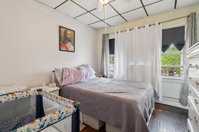 9406 76th St, Ozone Park, NY 11416 - bedroom with hardwood / wood-style floors, a drop ceiling, and a ceiling fan