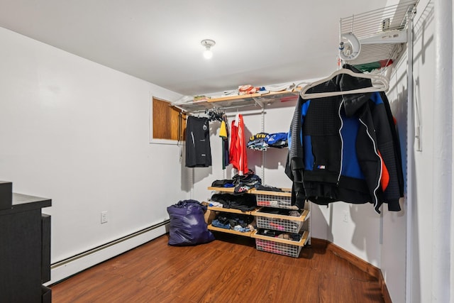 9406 76th St, Ozone Park, NY 11416 - spacious closet featuring baseboard heating and wood finished floors