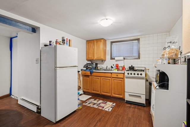 9406 76th St, Ozone Park, NY 11416 - kitchen with white appliances, a baseboard radiator, dark wood finished floors, and light countertops