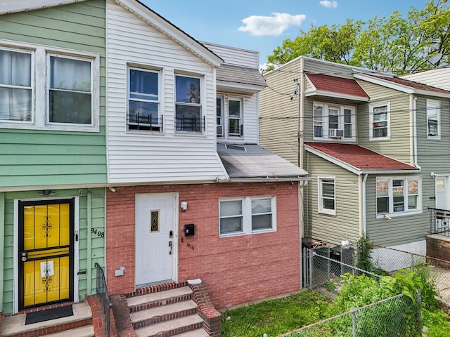 9406 76th St, Ozone Park, NY 11416 - view of property featuring entry steps and brick siding