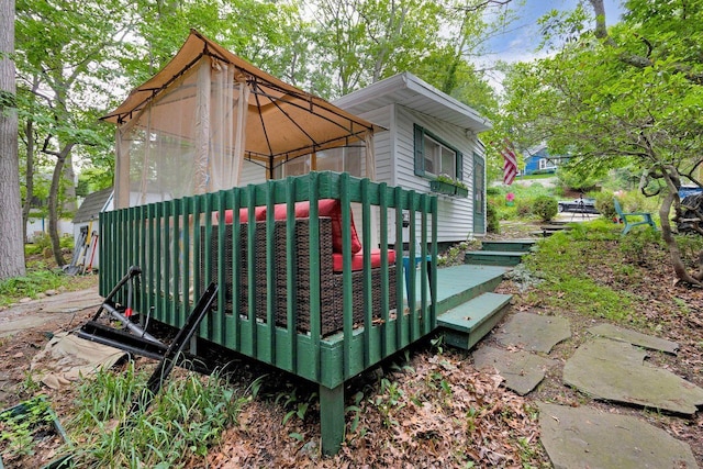 101 Alice St, Port Jefferson, NY 11777 - view of property exterior featuring a gazebo and a wooden deck