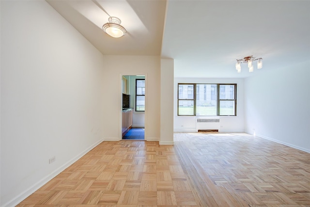 98-22 63rd Dr Unit 1D, Rego Park, NY 11374 - unfurnished room with radiator and baseboards