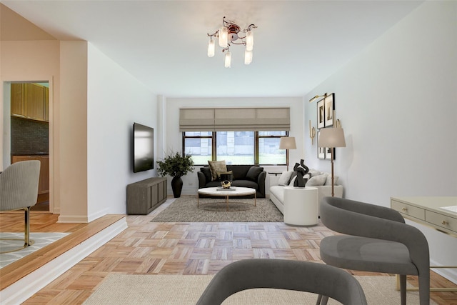 98-22 63rd Dr Unit 1D, Rego Park, NY 11374 - living area featuring baseboards and a chandelier