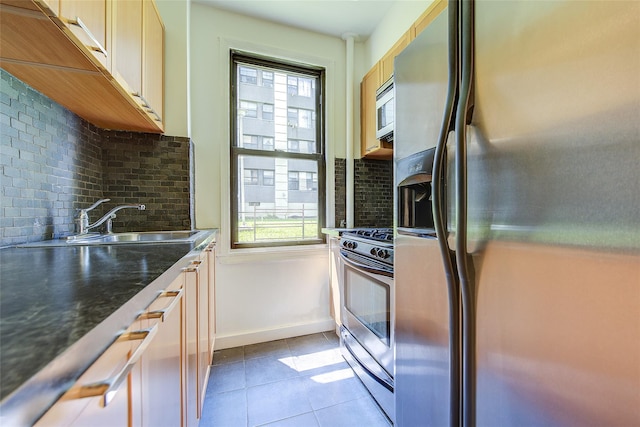 98-22 63rd Dr Unit 1D, Rego Park, NY 11374 - kitchen with appliances with stainless steel finishes, decorative backsplash, light tile patterned floors, and dark countertops