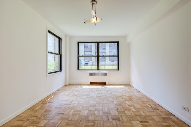 98-22 63rd Dr Unit 1D, Rego Park, NY 11374 - unfurnished room with radiator and baseboards