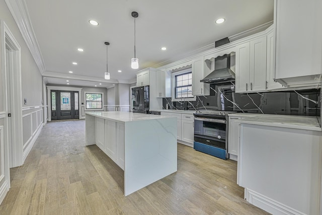 108 Bismark Ave, Valley Stream, NY 11581 - kitchen with black refrigerator with ice dispenser, electric stove, wall chimney range hood, crown molding, and a kitchen island