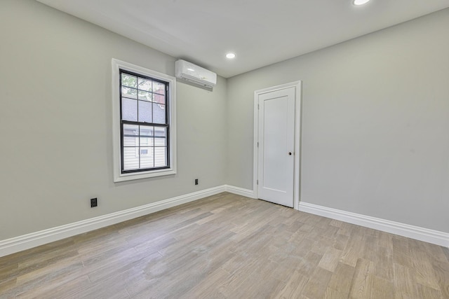 108 Bismark Ave, Valley Stream, NY 11581 - spare room featuring a wall mounted AC, light wood finished floors, and recessed lighting