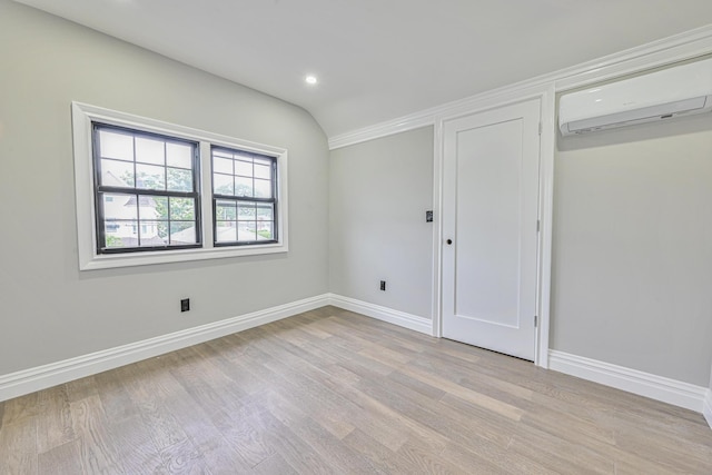 108 Bismark Ave, Valley Stream, NY 11581 - unfurnished bedroom featuring a wall unit AC, light wood-type flooring, and recessed lighting