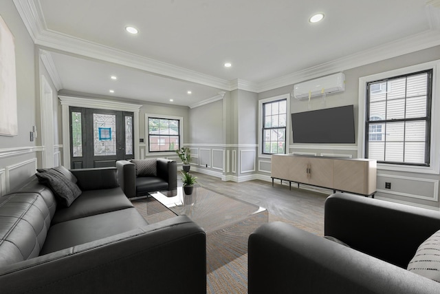 108 Bismark Ave, Valley Stream, NY 11581 - living room with a wall mounted air conditioner, a decorative wall, a wainscoted wall, wood finished floors, and recessed lighting