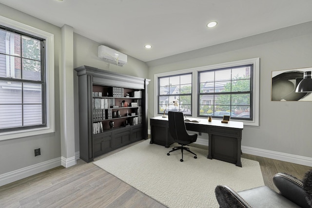 108 Bismark Ave, Valley Stream, NY 11581 - home office featuring light wood-type flooring, a wall mounted air conditioner, and recessed lighting