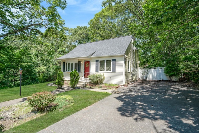 107 Cedar Ln, Medford, NY 11763 - view of front facade with driveway and roof with shingles