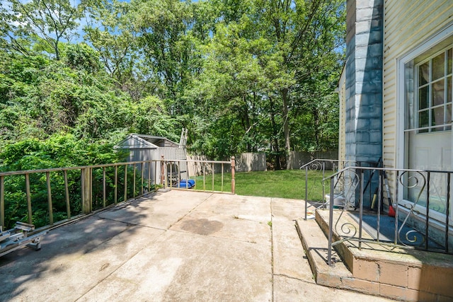 107 Cedar Ln, Medford, NY 11763 - fenced backyard with a patio and an outbuilding