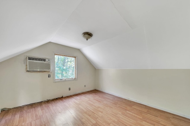 107 Cedar Ln, Medford, NY 11763 - bonus room featuring an AC wall unit, light wood-style floors, and vaulted ceiling