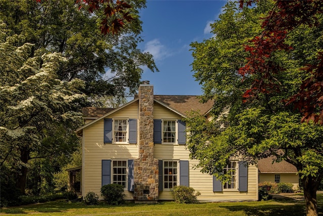 797 Western Rd, Call Listing Agent, NY 12033 - view of front of house with a chimney, a front lawn, and roof with shingles