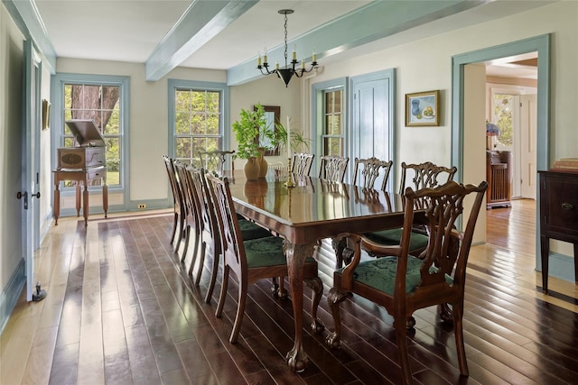 797 Western Rd, Call Listing Agent, NY 12033 - dining area with wood finished floors, a chandelier, and beam ceiling