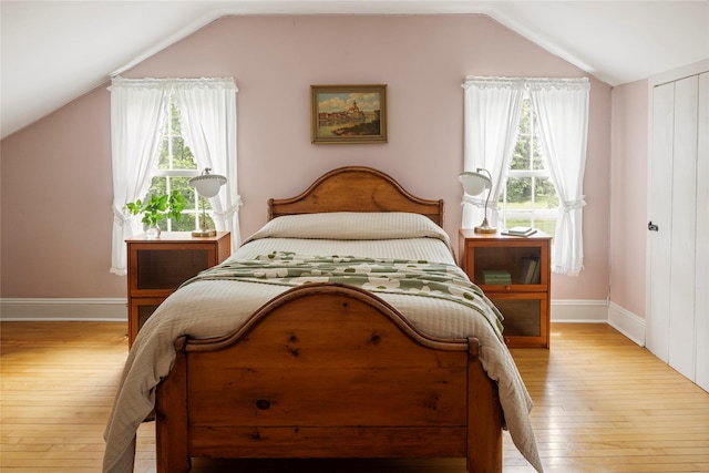 797 Western Rd, Call Listing Agent, NY 12033 - bedroom with lofted ceiling, wood-type flooring, and multiple windows