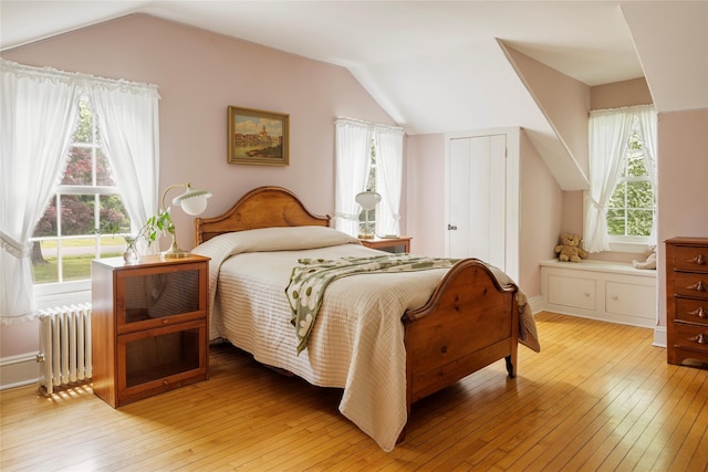 797 Western Rd, Call Listing Agent, NY 12033 - bedroom with radiator, lofted ceiling, and light wood-style flooring
