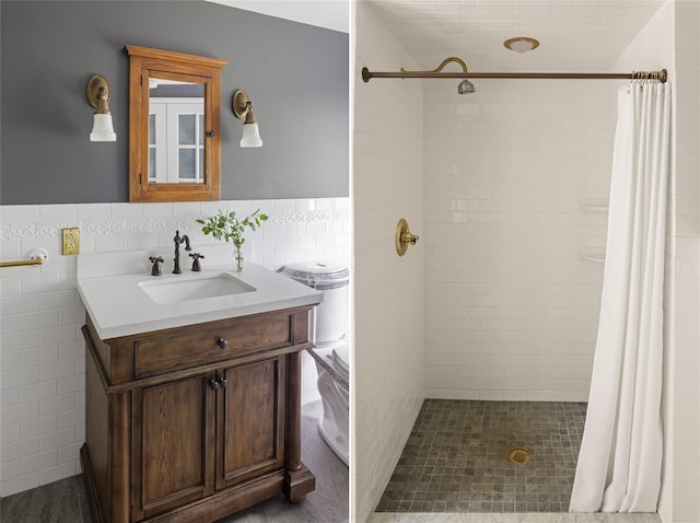 797 Western Rd, Call Listing Agent, NY 12033 - bathroom featuring tile walls, vanity, a tile shower, and a wainscoted wall