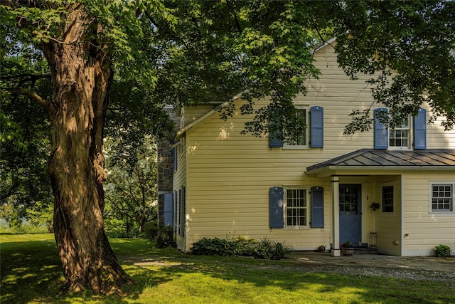 797 Western Rd, Call Listing Agent, NY 12033 - view of front of house featuring a standing seam roof, a front yard, and a metal roof