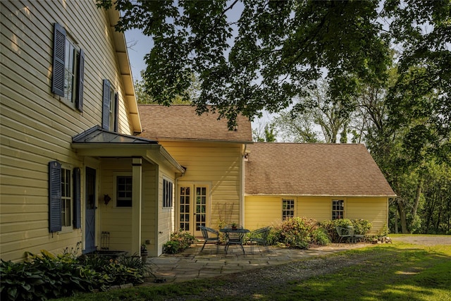 797 Western Rd, Call Listing Agent, NY 12033 - exterior space featuring a patio area and a shingled roof