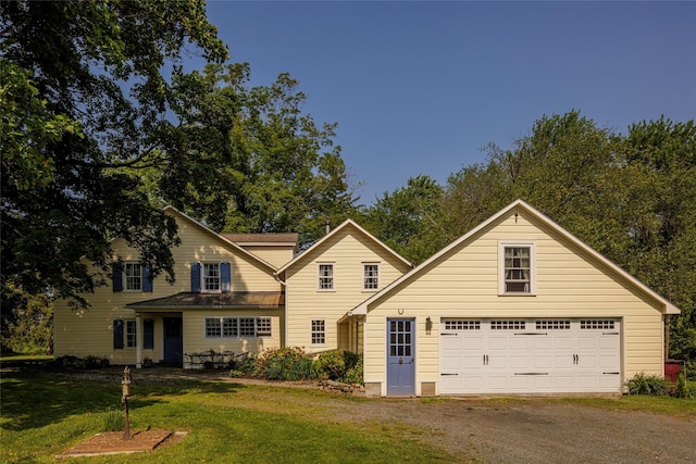 797 Western Rd, Call Listing Agent, NY 12033 - traditional-style home with driveway, a front lawn, a garage, and an outdoor structure