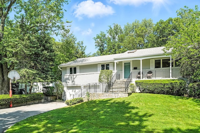 65 Shepherds Dr, Scarsdale, NY 10583 - ranch-style home featuring stairway, driveway, a porch, a front lawn, and an attached garage