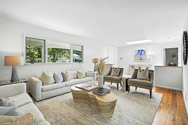 65 Shepherds Dr, Scarsdale, NY 10583 - living room featuring a skylight and wood finished floors