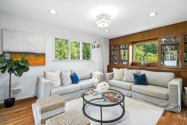 65 Shepherds Dr, Scarsdale, NY 10583 - living room featuring wood finished floors, recessed lighting, and wooden walls