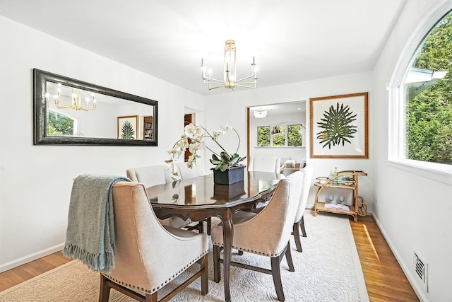 65 Shepherds Dr, Scarsdale, NY 10583 - dining area with a chandelier and plenty of natural light
